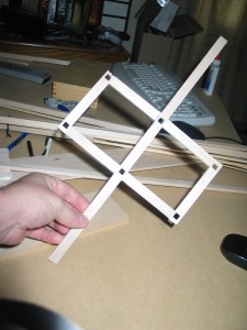 Built base. Notched 6 positions for frames using X-Acto knife.  Also note lateral stabilizing arms.